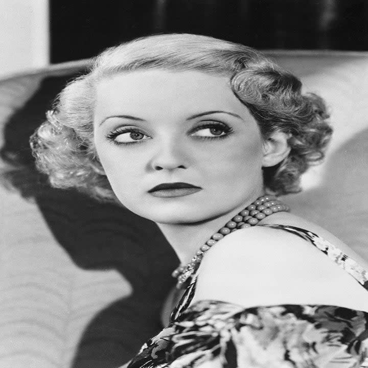 Bette Davis looking away for a photo