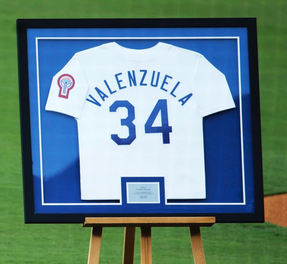 A framed No. 34 Fernando Valenzuela jersey is displayed on the field at Dodger Stadium before Friday's ceremony.