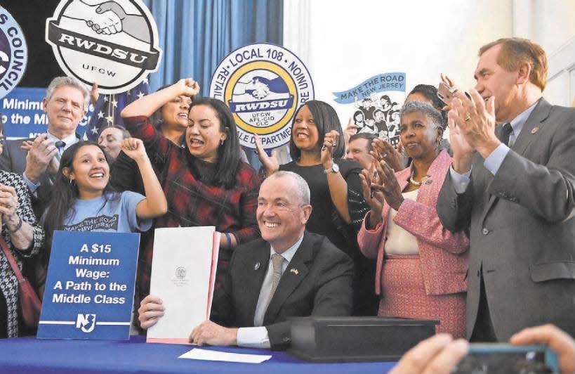 Gov. Phil Murphy signed a bill raising NJ’s minimum wage to $15 an hour during a ceremony at the headquarters of immigrant advocacy group Make the Road NJ in Elizabeth on Monday, Feb. 4, 2019. The minimum wage would rise incrementally to reach $15 an hour in 2024.