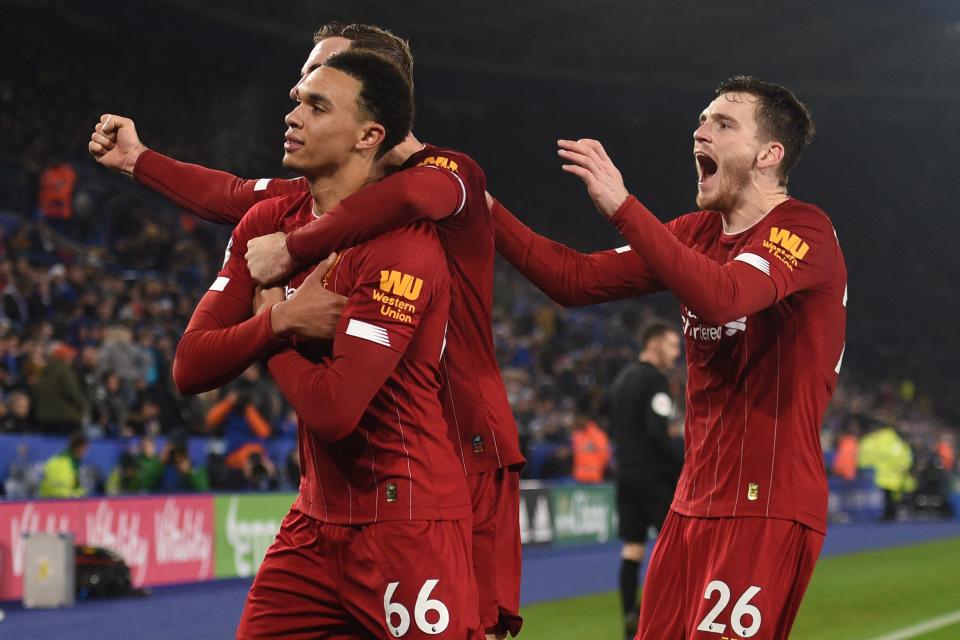 Liverpool's English defender Trent Alexander-Arnold (L) celebrates with teammates after scoring their fourth goal during the English Premier League football match between Leicester City and Liverpool at King Power Stadium in Leicester, central England on December 26, 2019. (Photo by Oli SCARFF / AFP) / RESTRICTED TO EDITORIAL USE. No use with unauthorized audio, video, data, fixture lists, club/league logos or 'live' services. Online in-match use limited to 120 images. An additional 40 images may be used in extra time. No video emulation. Social media in-match use limited to 120 images. An additional 40 images may be used in extra time. No use in betting publications, games or single club/league/player publications. /  (Photo by OLI SCARFF/AFP via Getty Images)