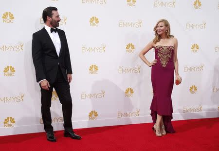 Actor Jon Hamm, from the AMC drama series "Mad Men," arrives with Jennifer Westfeldt at the 66th Primetime Emmy Awards in Los Angeles, California August 25, 2014. REUTERS/Lucy Nicholson