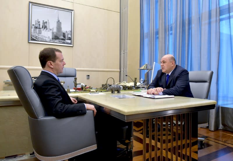 Russian Prime Minister Medvedev attends a meeting with head of the Federal Taxation Service Mishustin in Moscow