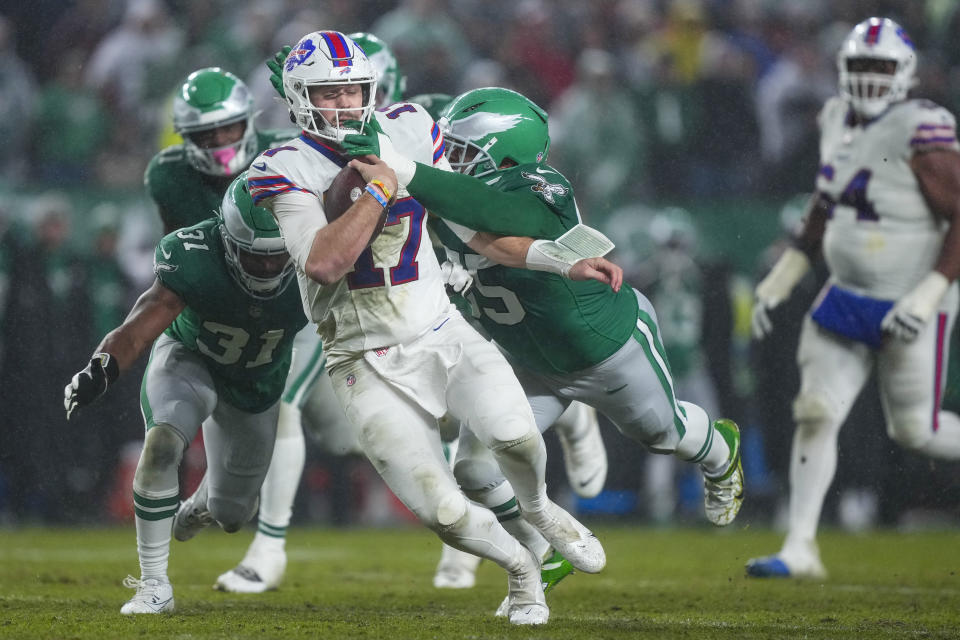 Buffalo Bills quarterback Josh Allen gets sacked by Philadelphia Eagles defensive end Brandon Graham during the first half of an NFL football game Sunday, Nov. 26, 2023, in Philadelphia. (AP Photo/Matt Rourke)