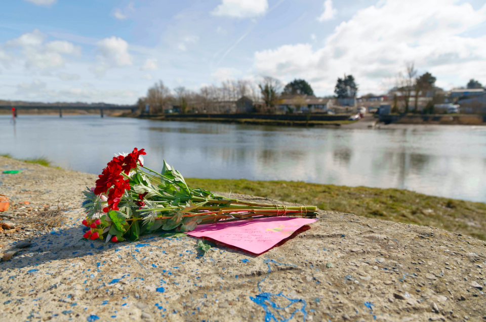 <em>Flowers were left at the slipway where the car entered the River Telfi (SWNS)</em>