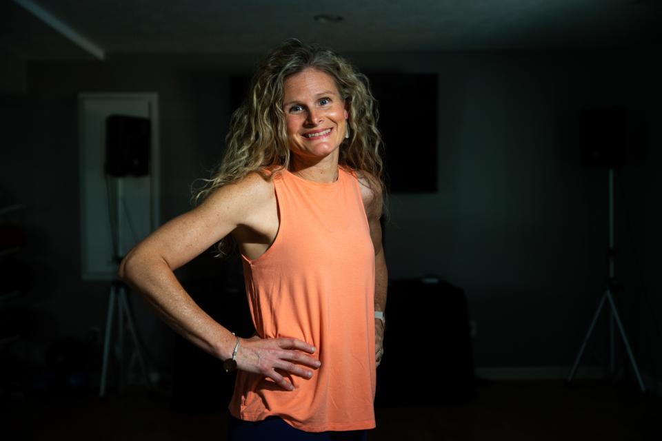 Health and wellness coach Amanda Villarreal poses for a portrait in her home studio Wednesday, May 24, 2023, in Zeeland.