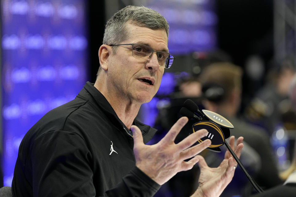 Michigan head coach Jim Harbaugh is interviewed during media day ahead of the national championship NCAA College Football Playoff game between Washington and Michigan Saturday, Jan. 6, 2024, in Houston. The game will played Monday. (AP Photo/David J. Phillip)