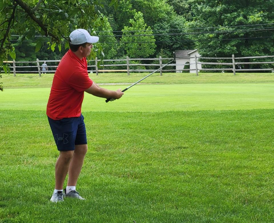 Jace Day watches his second shot head toward the green on No. 13 at Cascades Golf Course during his Men's Championship flight match on Satuday, July 8, 2023.