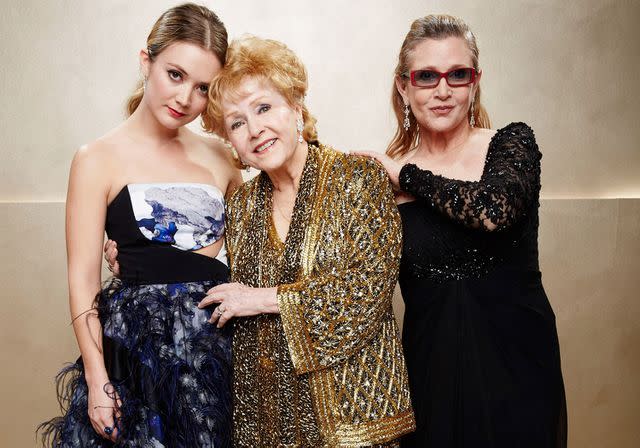 Kevin Mazur/WireImage Billie Lourd with grandmother Debbie Reynolds and mom Carrie Fisher in 2015