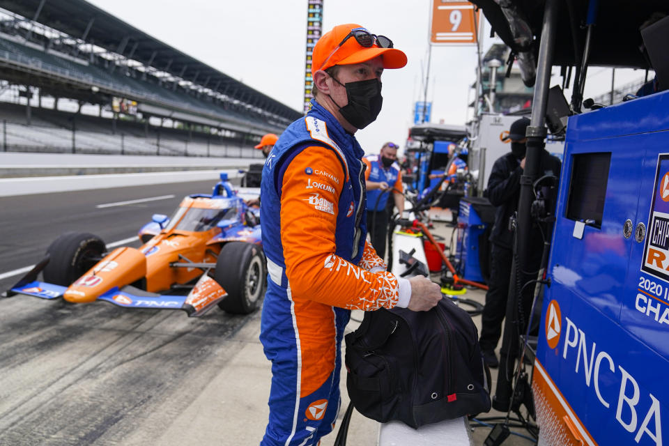 Scott Dixon, of New Zealand, bags up his helmet during practice for the Indianapolis 500 auto race at Indianapolis Motor Speedway in Indianapolis, Tuesday, May 18, 2021. (AP Photo/Michael Conroy)