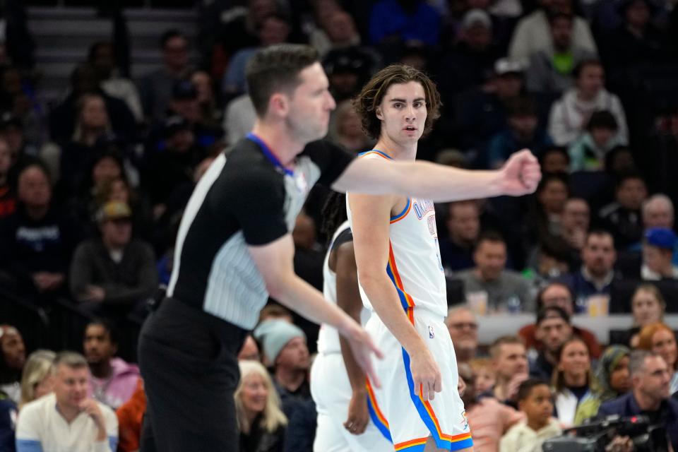 Referee Ben Taylor, left, signals as Oklahoma City Thunder guard Josh Giddey, right, watches during the first half of an NBA basketball In-Season Tournament game against the Minnesota Timberwolves on Tuesday in Minneapolis.