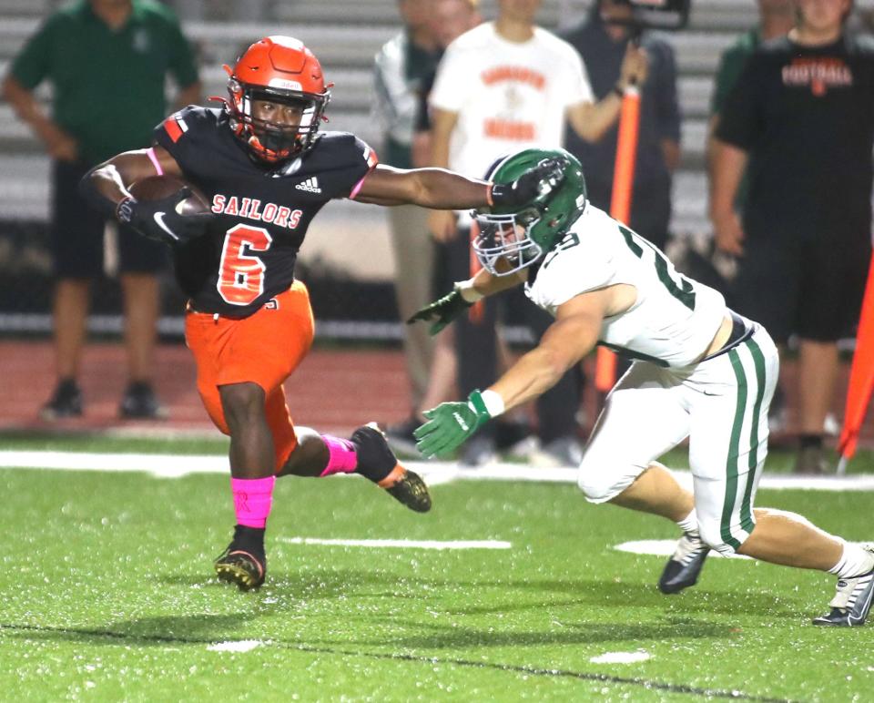 Sarasota running back Jaden Judge (6) stiff arms Venice linebacker Eli Seed (29) during Friday night football action in Sarasota, Fl. Venice won the matchup 46-7. MATT HOUSTON/HERALD-TRIBUNE