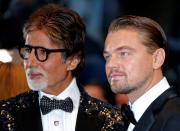 FILE PHOTO: Cast members Leonardo DiCaprio and Amitabh Bachchan pose as they arrive for the screening of the film 'The Great Gatsby' and for the opening ceremony of the 66th Cannes Film Festival