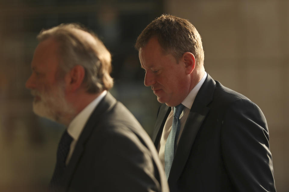 Britain's Brexit advisor David Frost, right, and British Ambassador to the EU Tim Barrow arrive at EU headquarters for a technical meeting on Brexit in Brussels on Monday, Oct. 14, 2019. (AP Photo/Francisco Seco)