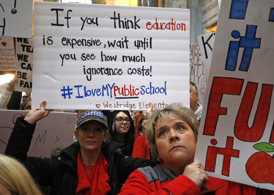 <p>Public school teachers and their supporters protest against a pension reform bill outside the senate chambers at the Kentucky State Capitol, April 2, 2018 in Frankfort, Ky. (Photo: Bill Pugliano/Getty Images) </p>