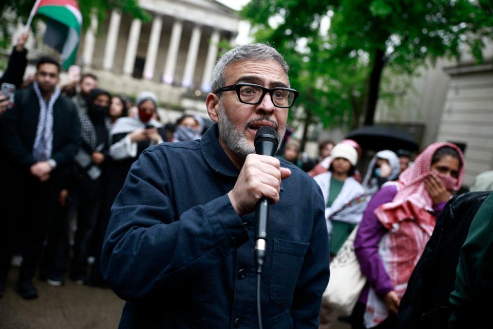 British-Palestinian plastic surgeon specialising in conflict injuries Ghassan Abu Sitta speaks to the press during a demonstration in support to Palestinian people at University College London (UCL) main entrance (AFP via Getty Images)