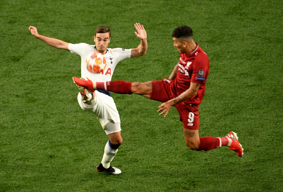 Tottenham Hotspur's Harry Winks is challenged by Liverpool's Roberto Firmino during the UEFA Champions League Final at the Wanda Metropolitano, Madrid.