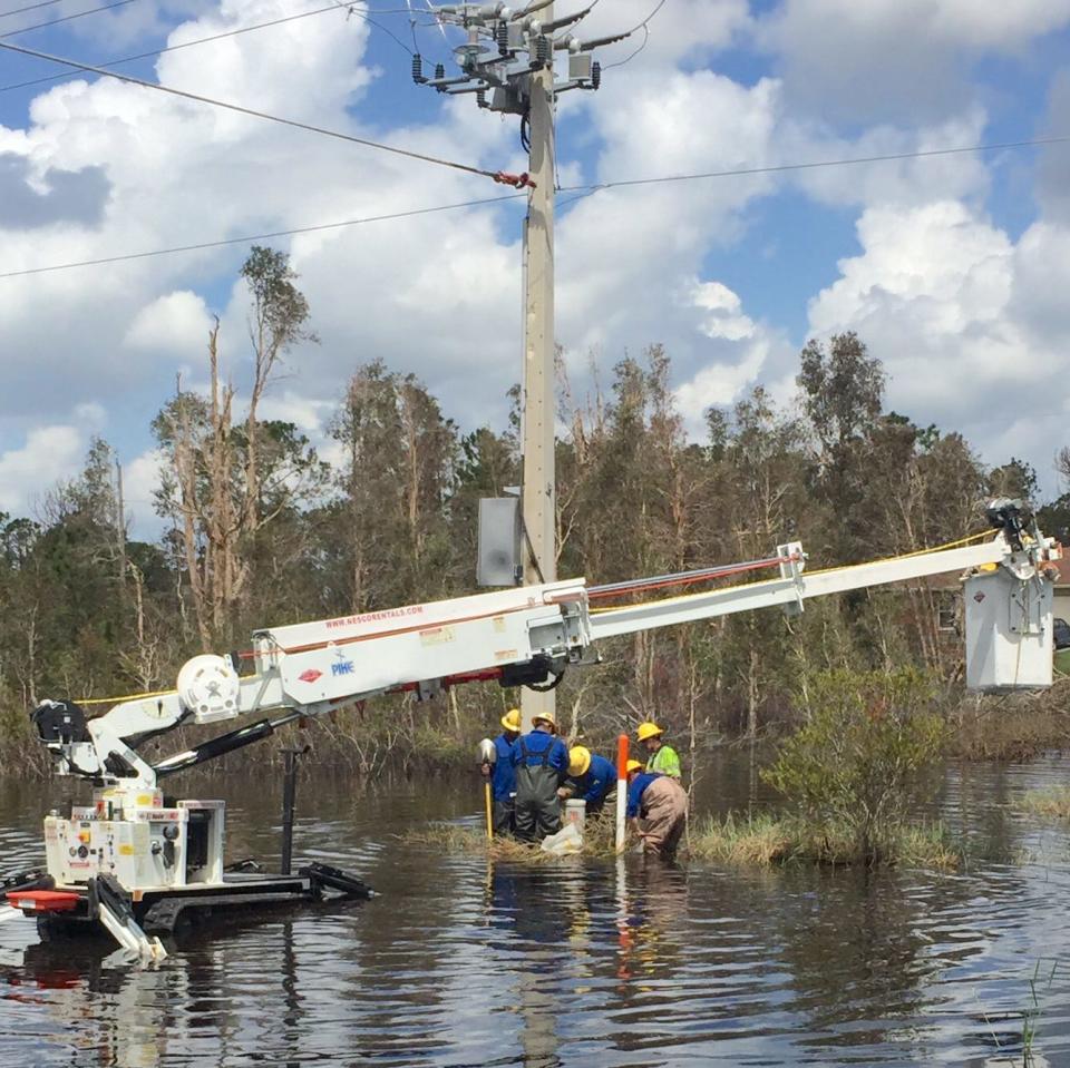 LCEC crews work to restore a power line after a storm.