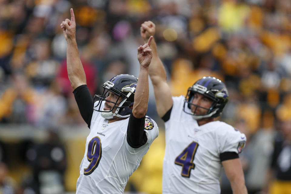 Baltimore Ravens kicker Justin Tucker (9) and Sam Koch (4) celebrate after Tucker made a field goal to defeat the Pittsburgh Steelers in overtime of an NFL football game, Sunday, Oct. 6, 2019, in Pittsburgh. The Ravens won 26-23. (AP Photo/Don Wright)