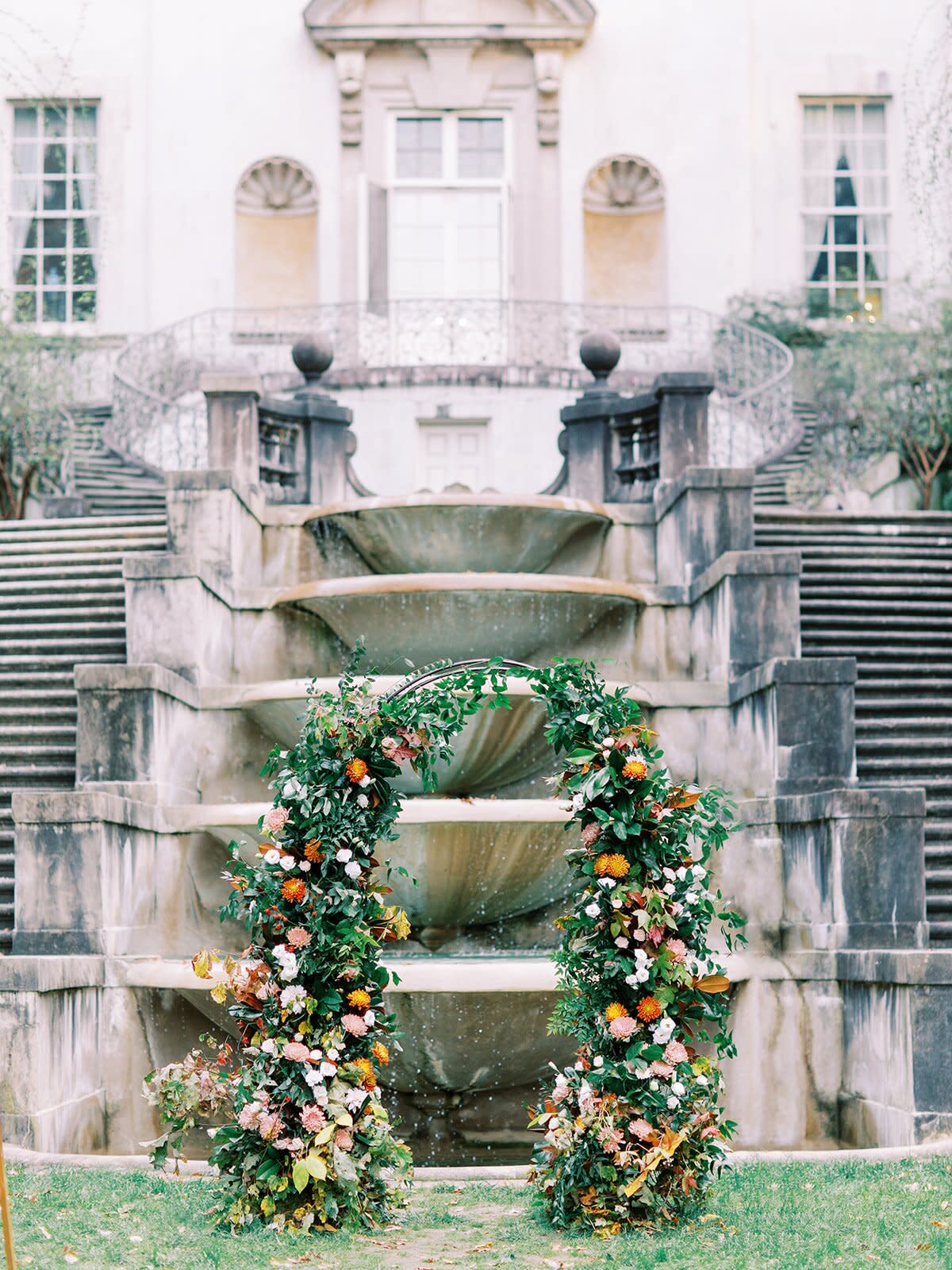 ceremony arch in front of fountain