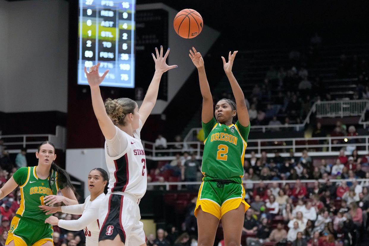 Oregon guard Chance Gray (2) shoots over Stanford forward Brooke Demetre (21) during the first half of an NCAA college basketball game Friday, Jan. 19, 2024, in Stanford, Calif. (AP Photo/Tony Avelar)