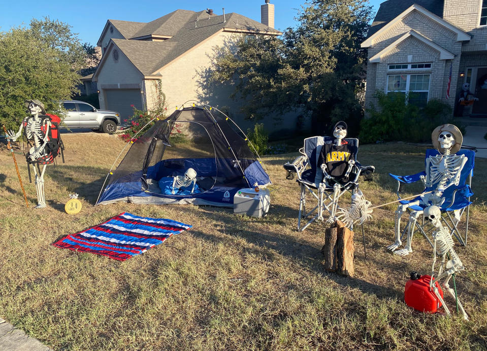 Steven and Danielle Dinote of Texas staged a skeleton-themed camping scene on their front lawn. (Courtesy Steven Dinote)