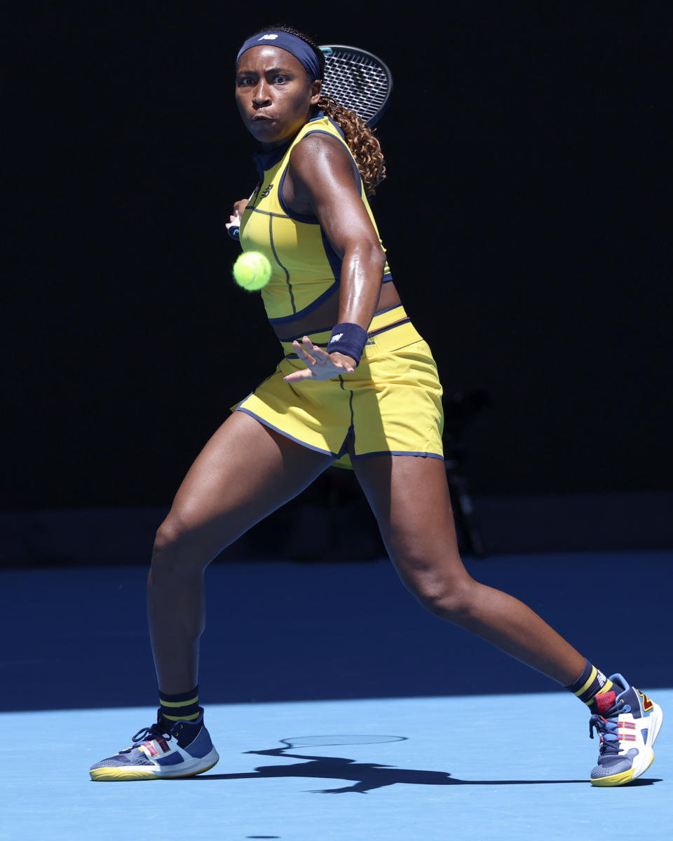 Coco Gauff of the U.S. plays a forehand return to Anna Karolina Schmiedlova of Slovakia during their first round match at the Australian Open tennis championships at Melbourne Park, Melbourne, Australia, Monday, Jan. 15, 2024. (AP Photo/Asanka Brendon Ratnayake)