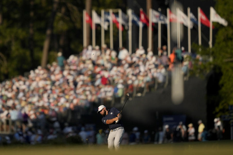 Tyrrell Hatton, of England, hits from the fairway on the 18th hole during the third round of the U.S. Open golf tournament Saturday, June 15, 2024, in Pinehurst, N.C. (AP Photo/Matt York)