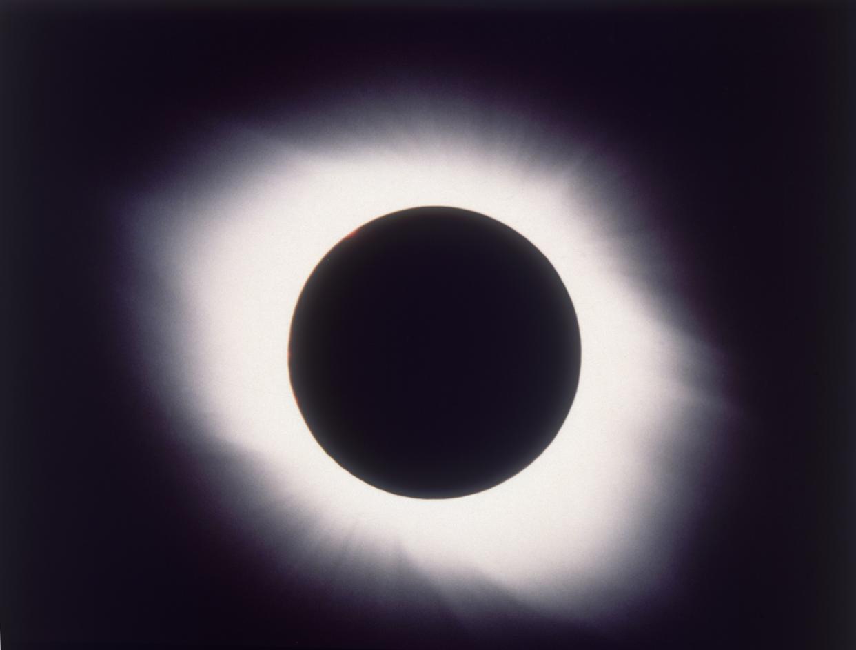 1998: The corona of the sun is visible around the moon during a total solar eclipse as seen in Guadeloupe. 