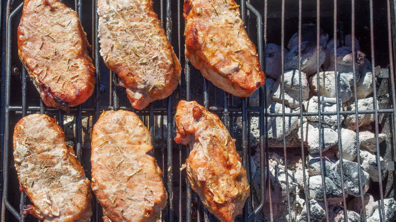 steaks grilling over indirect heat