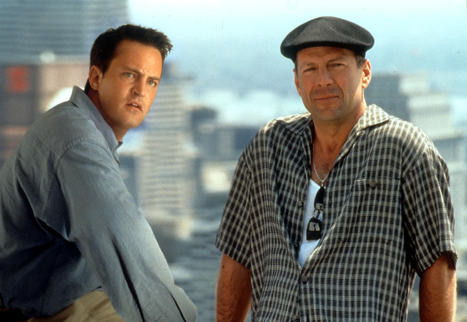 Matthew Perry and Bruce Willis look over the city in a scene from the film 'The Whole Nine Yards', 2000. (Photo by Warner Brothers/Getty Images)
