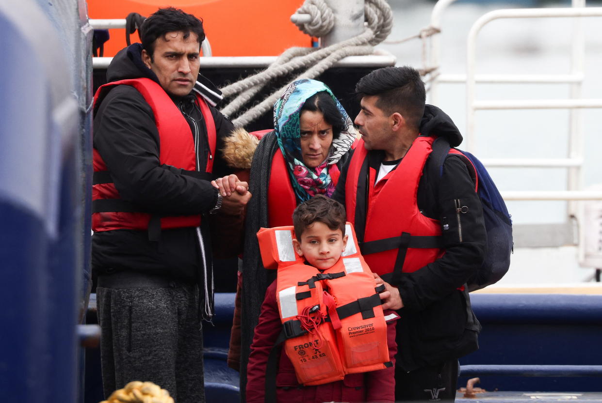 Migrants disembark from a Border Force vessel at Dover Harbour, after being rescued while crossing the English Channel, in Dover, Britain, May 3, 2022. REUTERS/Henry Nicholls