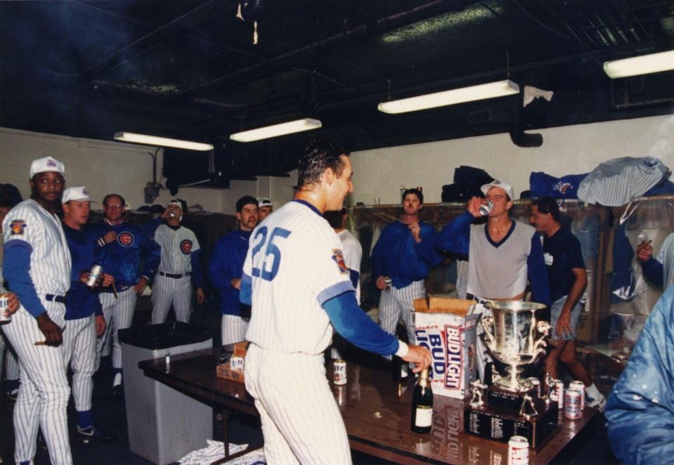 Members of the Iowa Cubs celebrate their 1993 title in the Sec Taylor Stadium clubhouse.