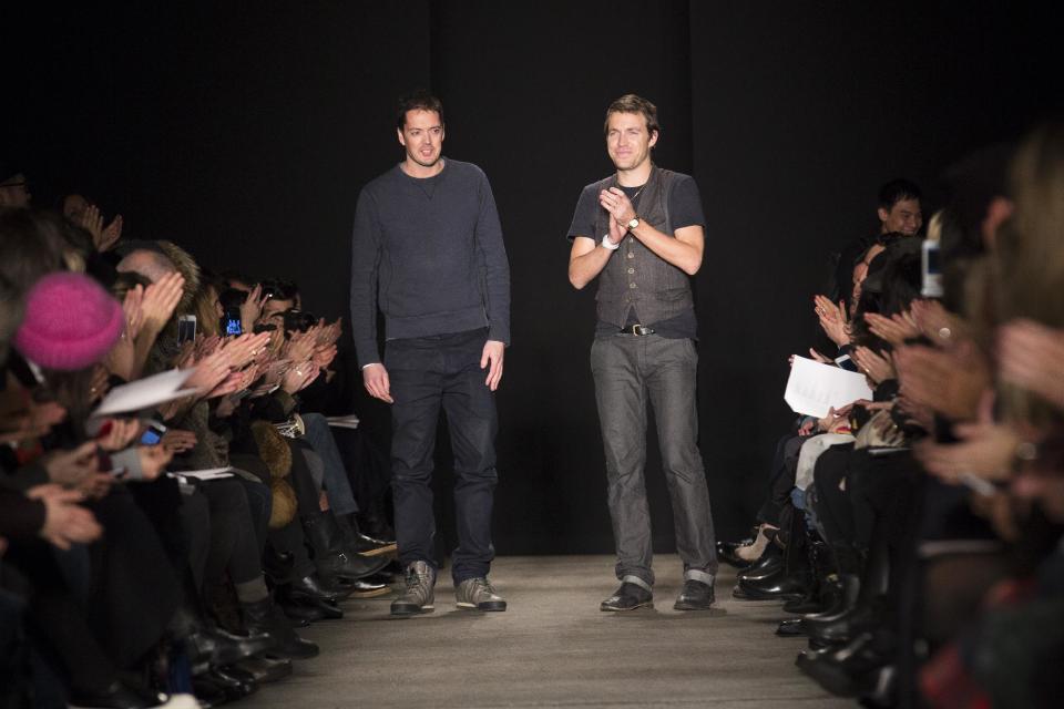 Designers Marcus Wainwright, left, and David Neville greet the crowd after the presentation of the Rag & Bone Fall 2013 fashion collection during Fashion Week, Friday, Feb. 8, 2013, in New York. (AP Photo/John Minchillo)