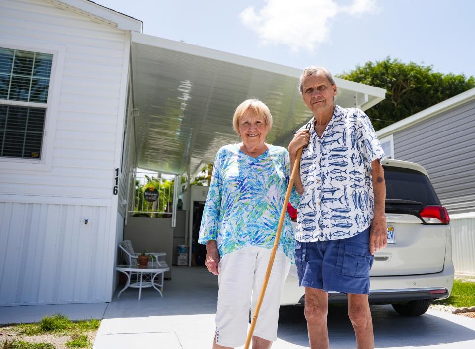 Charles and Julie Fox pose for a photo at their new Moorhead Manor manufactured home in Naples on Tuesday, Aug. 22, 2023. The home is raised to help prevent future damage from flooding.