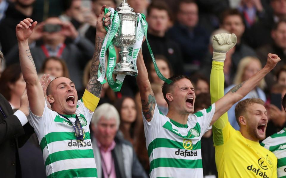 Celtic's Scott Brown and Mikael Lustig lift the Scottish Cup for the third time in a row at Hampden Park - Action Images via Reuters