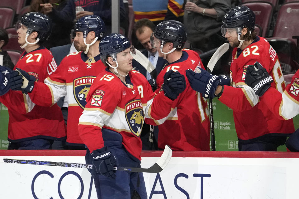 Florida Panthers left wing Matthew Tkachuk (19) is congratulated for his goal against the Arizona Coyotes during the first period of an NHL hockey game Wednesday, Jan. 24, 2024, in Sunrise, Fla. (AP Photo/Lynne Sladky)