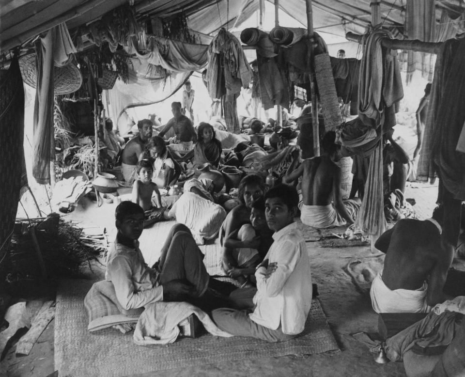 Refugees in a makeshift camp at Bongaon, fleeing fighting on the border between India and Pakistan, 26th June 1971. <a href="https://www.gettyimages.com/detail/news-photo/refugees-in-a-makeshift-camp-at-bongaon-fleeing-fighting-on-news-photo/831668538?phrase=refugee%20india%20fleeing%20camp%201971&adppopup=true" rel="nofollow noopener" target="_blank" data-ylk="slk:Mark Edwards/Keystone Features/Getty Images;elm:context_link;itc:0;sec:content-canvas" class="link ">Mark Edwards/Keystone Features/Getty Images</a>