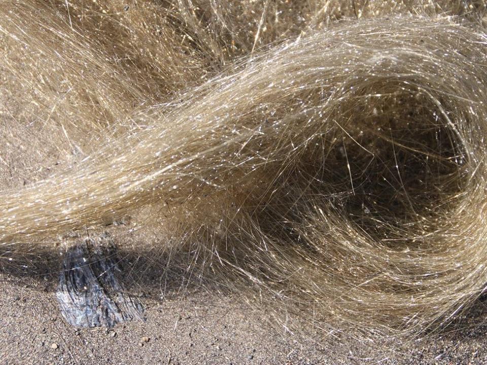 A hair like bundle of thin golden strands is actually lava.