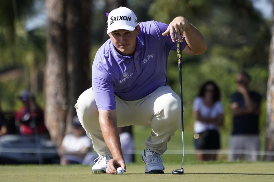 Sepp Straka lines his putt on the eighth green during the final round of the Honda Classic golf tournament, Sunday, Feb. 27, 2022, in Palm Beach Gardens, Fla. (AP Photo/Marta Lavandier)