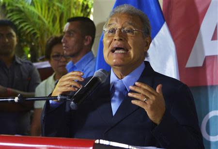 Salvador Sanchez Ceren of the ruling Farabundo Marti National Liberation Front (FMLN) addresses followers and the media during a news conference in San Salvador March 13, 2014. REUTERS/Jessica Orellana