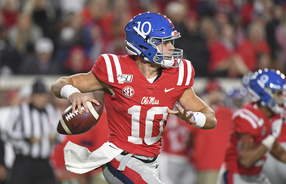 Mississippi quarterback John Rhys Plumlee (10) looks for a receiver during the first half of the team's NCAA college football game against LSU in Oxford, Miss., Saturday, Nov. 16, 2019. (AP Photo/Thomas Graning)