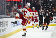 Calgary Flames center Connor Zary (47) celebrates his goal against the Anaheim Ducks during the second period of an NHL hockey game Friday, April 12, 2024, in Anaheim, Calif. (AP Photo/Kyusung Gong)