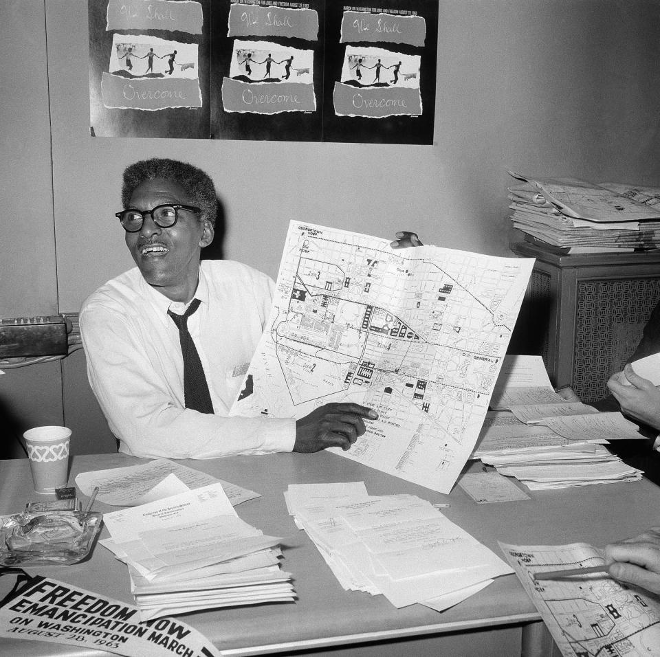 FILE - During a news conference in New York on Aug. 24, 1963, Bayard Rustin, deputy director of the planned March on Washington, points to a map showing the route of the Aug. 28, 1963 Civil Rights march. (AP Photo/File)