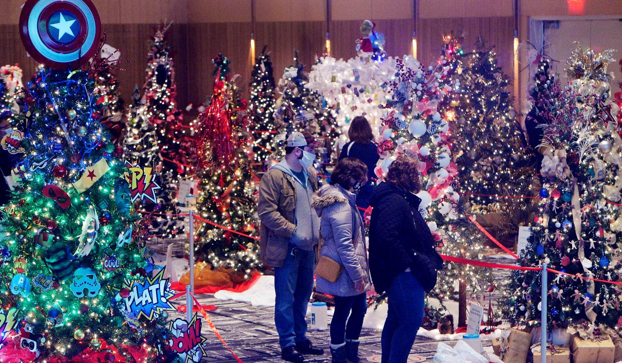 People visit the 2021 Festival of Trees at the Bayfront Convention Center in Erie. Professionally-decorated holiday trees will be displayed again this year at the three-day event which benefits Saint Vincent Hospital and the Children's Miracle Network.