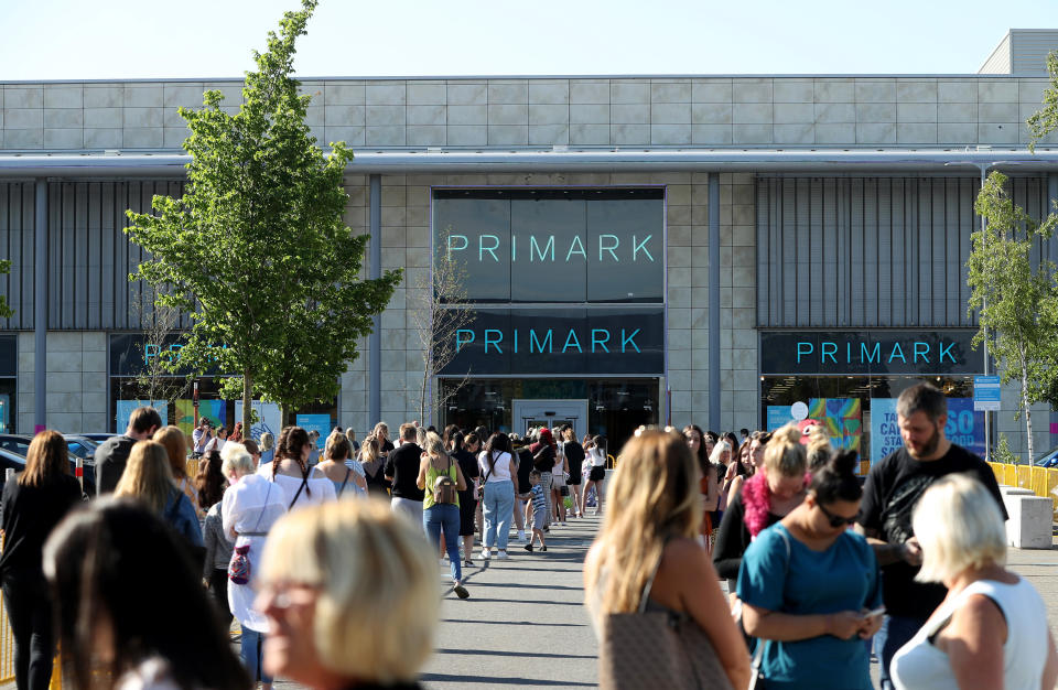 Queues form at Primark at the Rushden Lakes shopping complex after reopening on Monday.