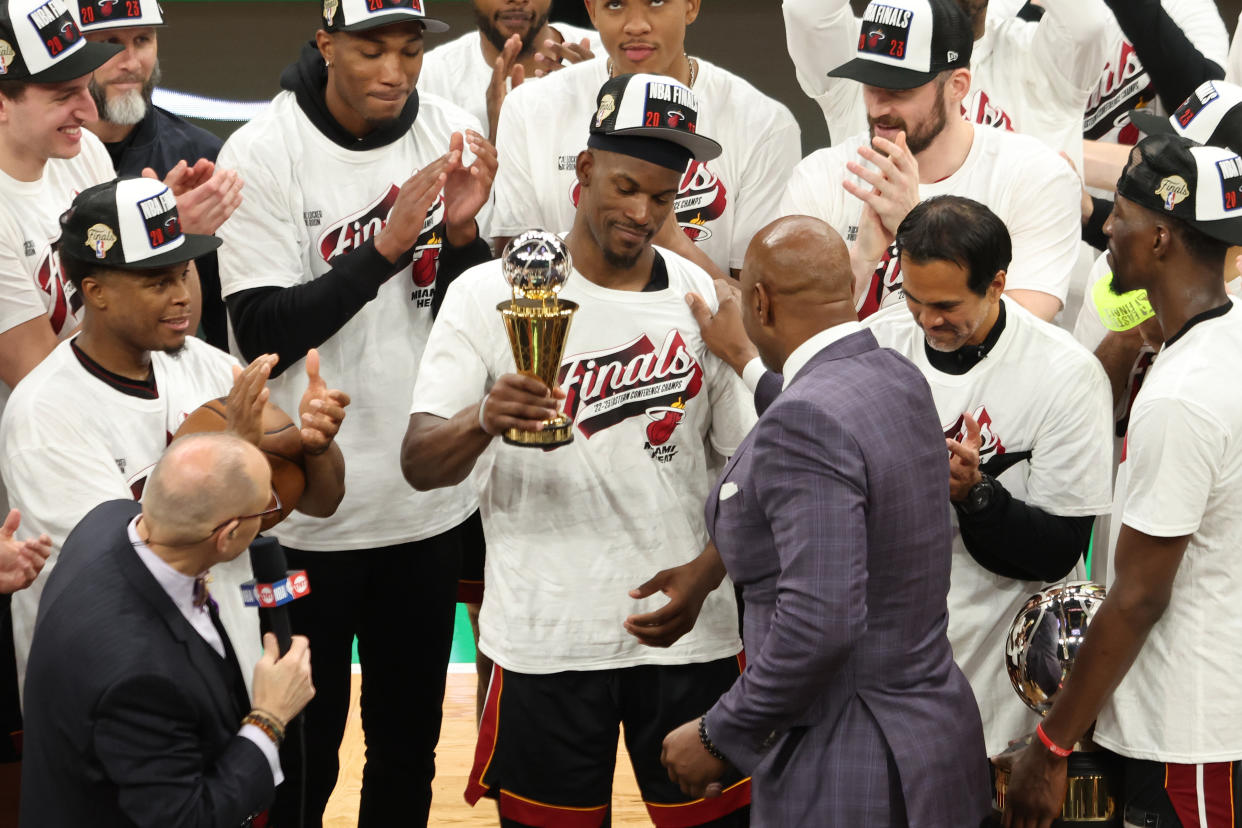 Hall of Famer Alonzo Mourning presents Miami Heat star Jimmy Butler with the Eastern Conference finals MVP award after his team's Game 7 victory against the Boston Celtics. (Adam Glanzman/Getty Images)