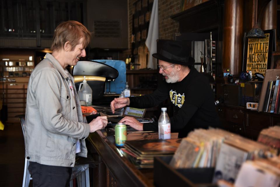 Britt Daniel of the Austin band Spoon buys the Bee Gees' 1968 album “Idea” from Astro Record Store owner "Lippy" Mawby. Daniel said he had long been searching for the record.
