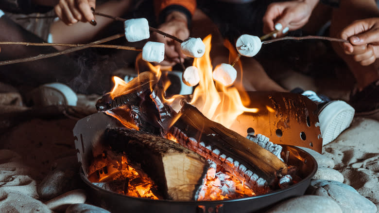 Many marshmallows over a fire