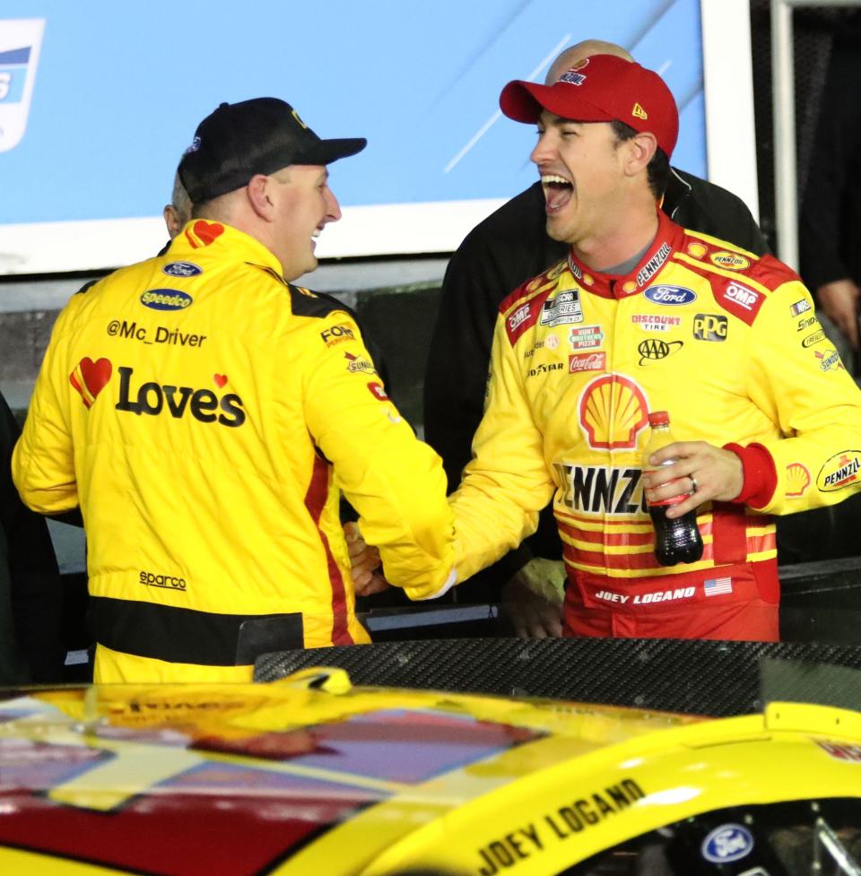 Joey Logano (right) and Michael McDowell share a laugh in Victory Lane after claiming the top two spots in Daytona 500 qualifying on Wednesday night at Daytona International Speedway.