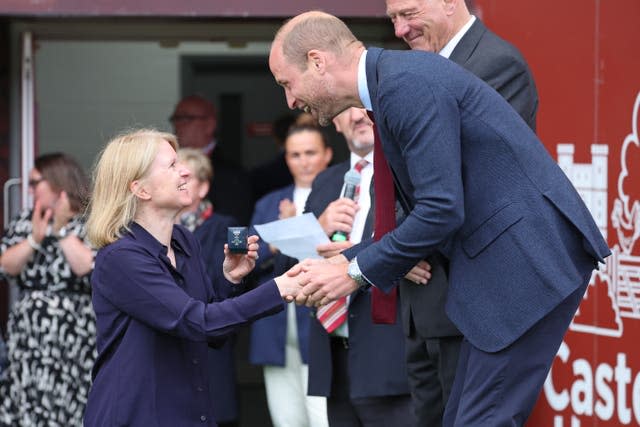 William, patron of the Welsh Rugby Union, presents a brooch to a former player from the WRU’s Missing Caps campaign, which aims to recognise players who were historically missed when they played for Wales